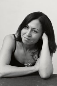 Sunyi Dean is the author of The Girl with a Thousand Faces